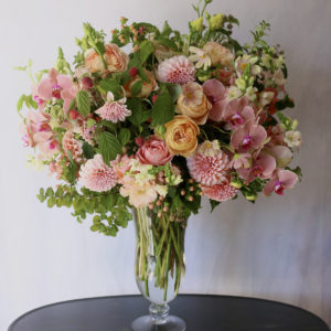 floral arrangement designed in a large glass vase, garden style by alicia schwede, floral design class