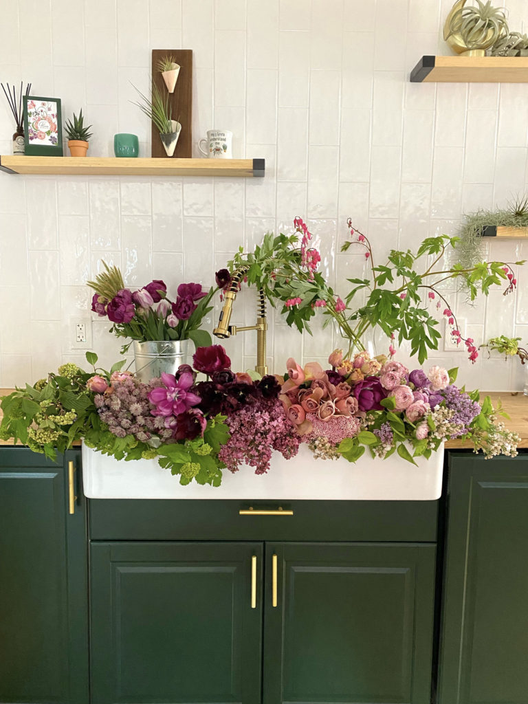 fleurs creative floral design studio with flowers in the farm sink