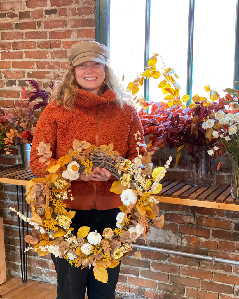 Fall wreath workshop at Fleurs Creative, Beverly Blooms with a golden wreath of dried flowers and foliages