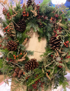 Christmas Wreath - Natural rose hips and pinecones with cedar. Wreath Workshop Snohomish