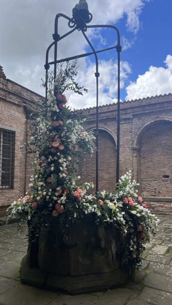 flower arranging workshop in Italy with Alicia of flirty fleurs, fountain decorated with flowers