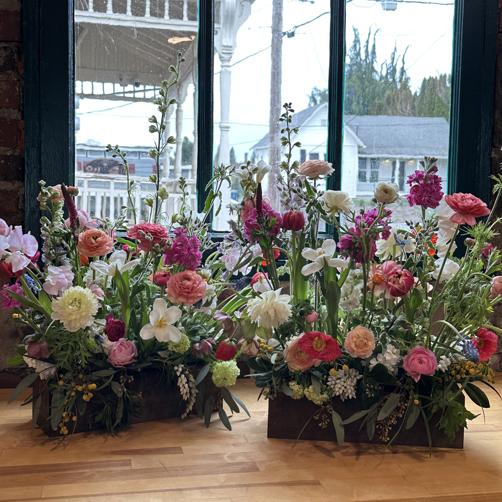 Garden inspired floral design class in a rectangular garden box. Fleurs Creative Floral Design Workshop
