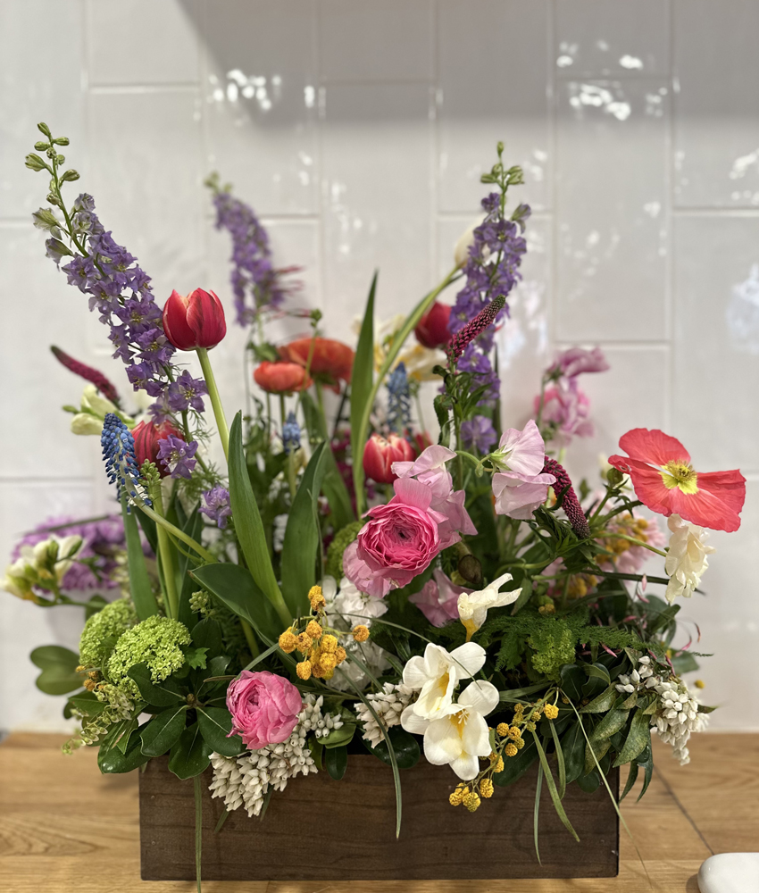 Vertical flower arrangement with spring flowers. Flower Arranging Classes